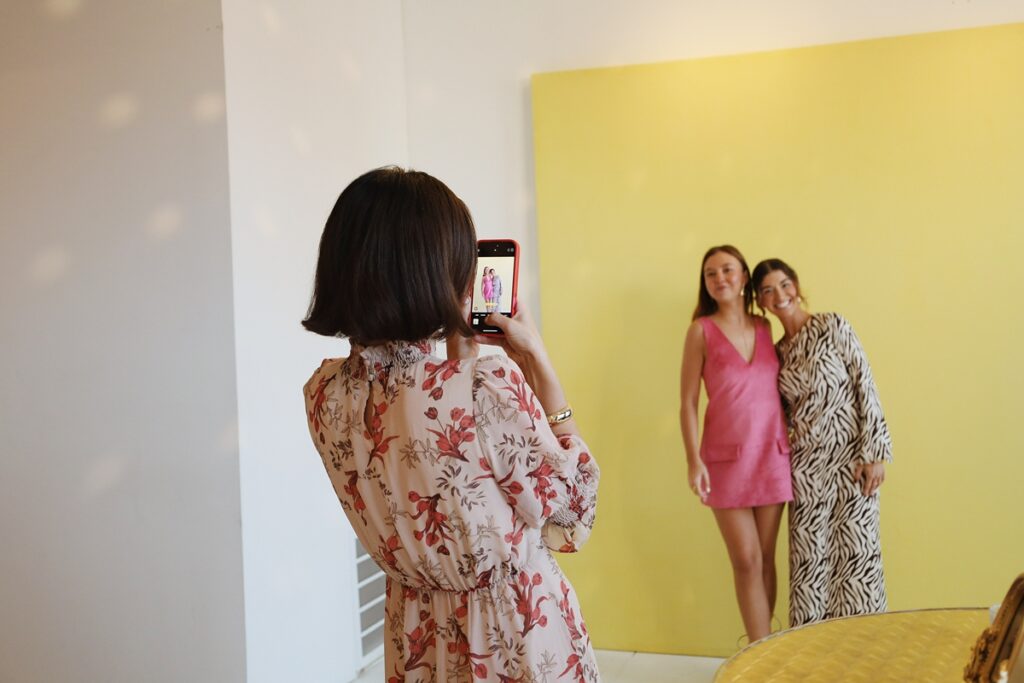 guest pose on a backdrop at Le Loft