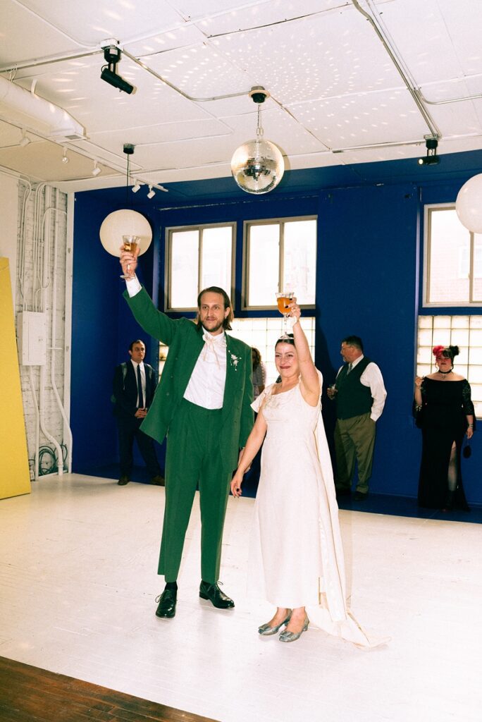 Bride and groom toast guest at Le Loft in Wicker Park