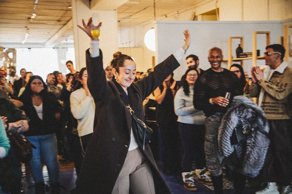 a guest cheers after winning a raffle at an event