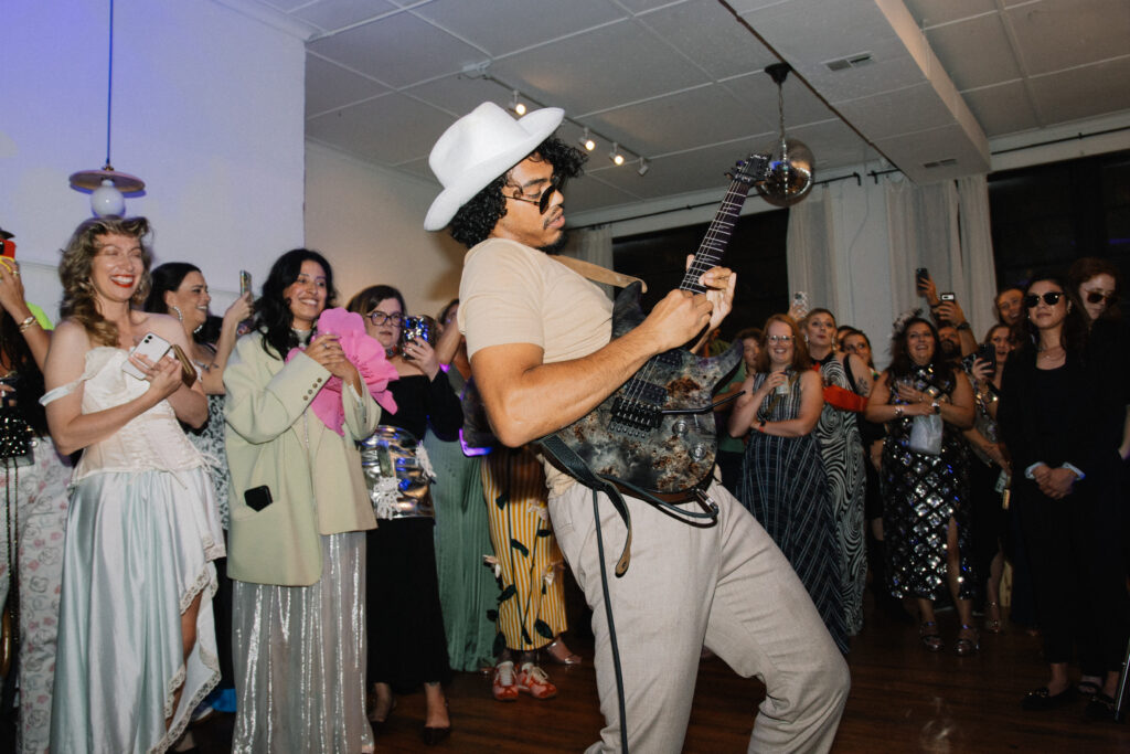 a guitar player performs at a birthday party in chicago at Le Loft